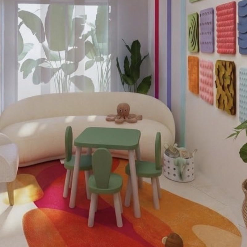 Sala de juego terapéutica con tienda de campaña y materiales